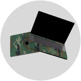 Laptop with a camouflage skin on a white background